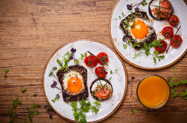 Fried eggs, salmon canape and  tomatoes