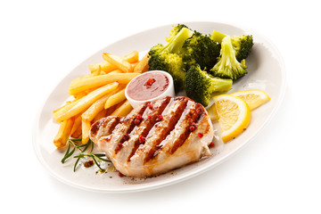 Grilled steak, chips and vegetable salad 