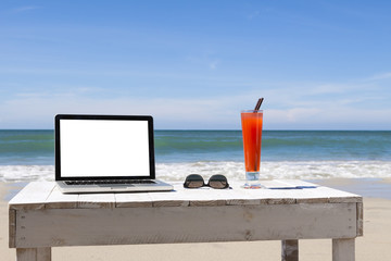 Working on the beach, white blank screen for copy-space