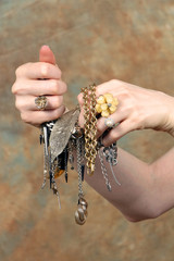Hands holding jewelry