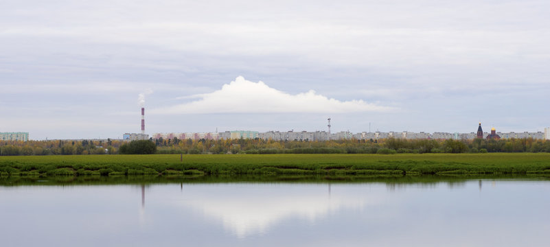 Cloud over city, city skyline with the waterfront.