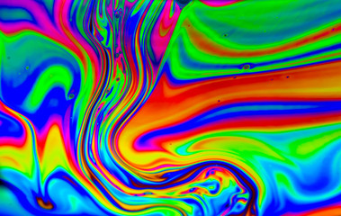Rainbow colors created by soap bubble can use for background 