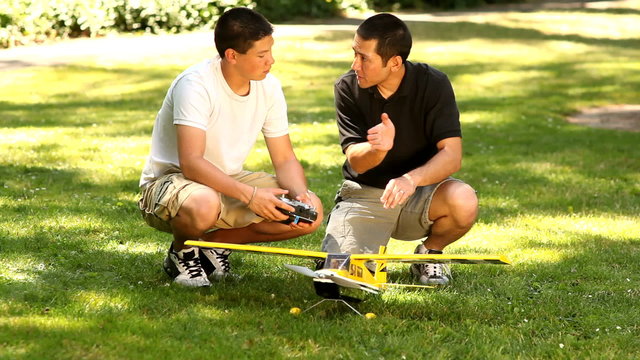 Father and son with model airplane