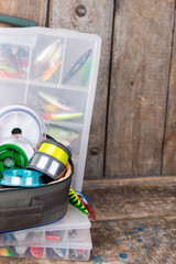 fishing tackles, lures and baits in boxes