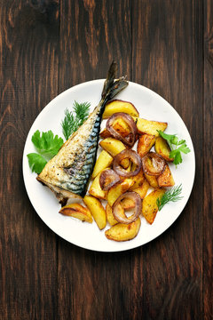 Potato wedges and grilled macarel fish