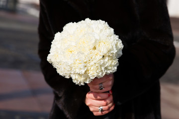 Beautiful wedding bouquet of flowers in bride’s hands