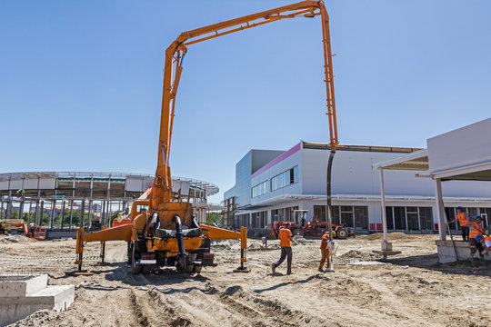 Construction pump crane for lifting and casting concrete.