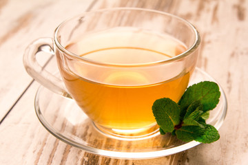 Green tea in a cup and mint