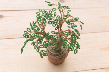 unique bouquet of handmade beads on wodden plate