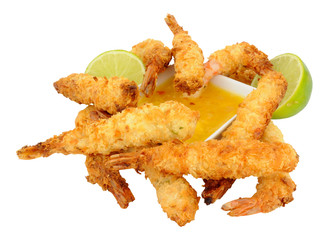 Coconut and batter coated prawns with fresh lime and mango dip isolated on a white background
