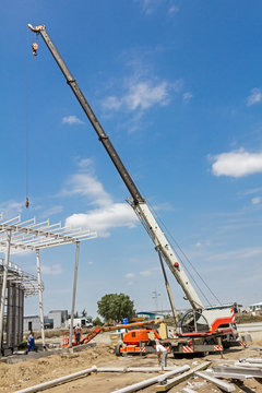 Mobile crane is preparing for work.