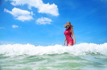 Fototapeta na wymiar Carefree young woman enjoying clear tropical water