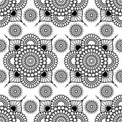 Background with black and white mehndi henna seamless floral lace buta decoration items on white background in Indian style.