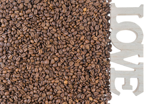 Fototapeta Coffee beans / Coffee beans and wooden letters with the word love