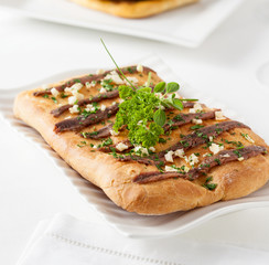 Coca with anchovies typical from Catalonia, Spain