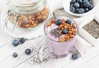 Overnight chia seeds and blueberry yogurt with homemade granola.Healthy eating concept.Selective focus