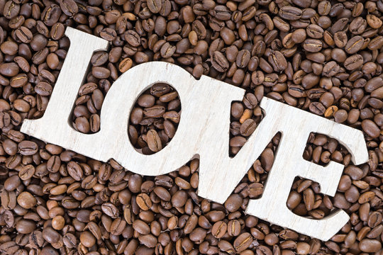 Fototapeta Coffee beans / Coffee beans and wooden letters with the word love