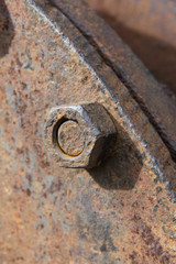rusty old metal plate with screwed nuts