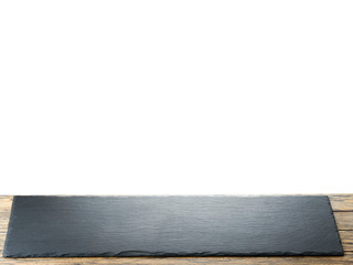 Empty black slate plate on the table