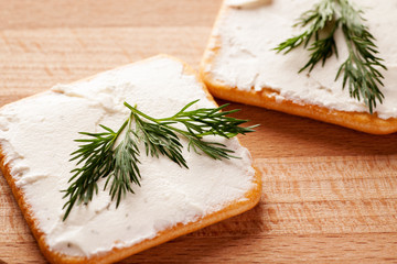 Crackers with spread cheese and dill