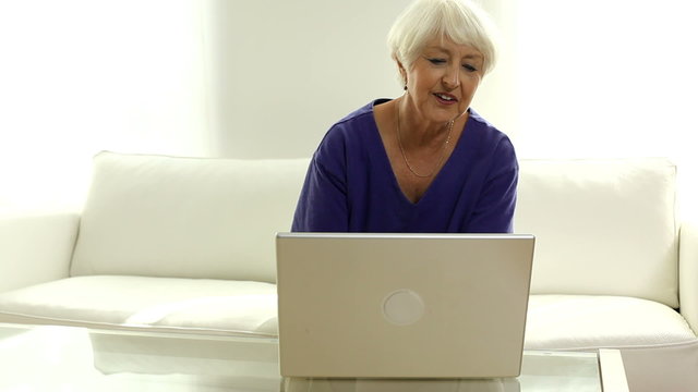 Senior woman using laptop computer