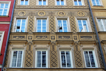 Fototapeta na wymiar The walls of an ancient town./The view of the walls of the houses of Old Town in Warsaw. Beautiful decorating in ancient style.