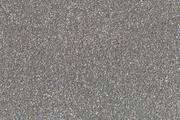 Silver sparkle glitter background.  Low contrast photo.