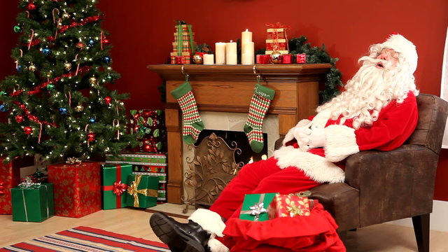 Santa Claus sleeping in living room