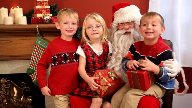 Children sitting with Santa Claus