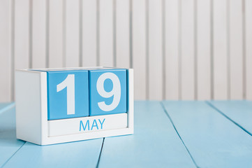 May 19th. Image of may 19 wooden color calendar on white background.  Spring day, empty space for...
