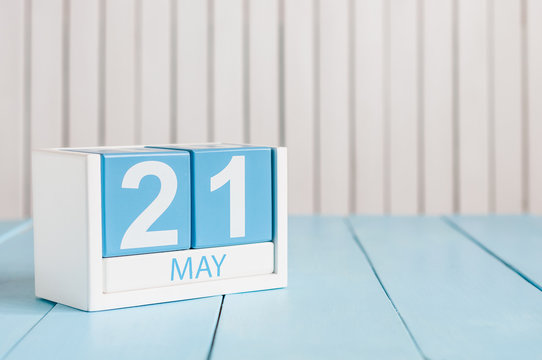 May 21st. Image of may 21 wooden color calendar on white background.  Spring day, empty space for text