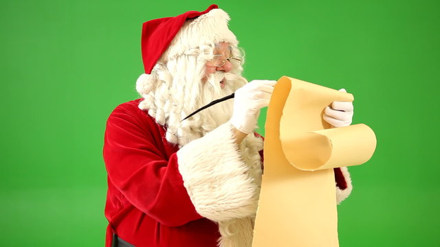 Santa Claus writing on list