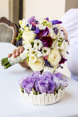 Bouquet with violet orchid, pink roses and freesia flowers