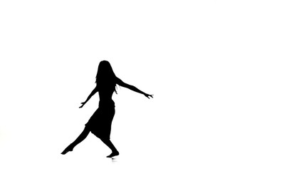 Graceful girl with long hair dance modern contemporary style and jumps on white, silhouette, slow motion
