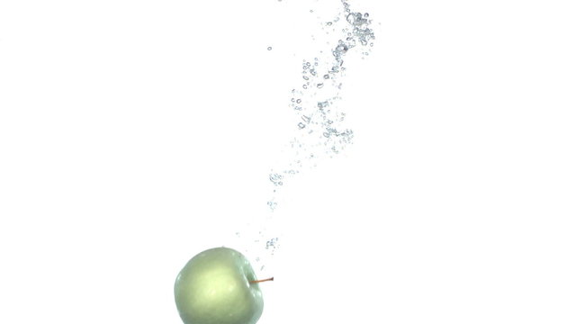 Apple falling through water