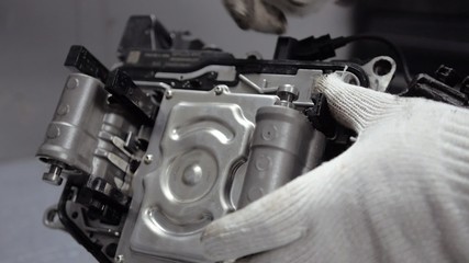 Repair Element of Automatic Car Transmission at Workshop
