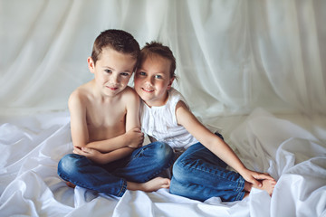 Cute little brother and sister at home