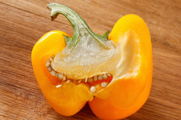 Fototapeta na wymiar fresh yellow bell pepper, cut one on white background