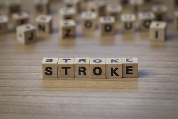 Stroke written in wooden cubes