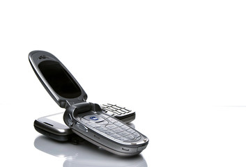 Two old design silver cell phones, close up