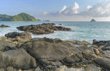 Fototapeta na wymiar Natural rock with strong water wave at Belanak Beach, Lombok, Indonesia