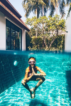 Child in the pool underwater