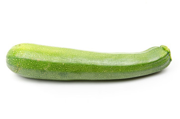 green zucchini on white background