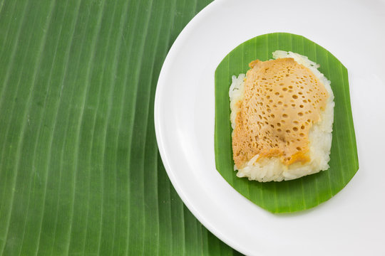 sticky rice with steamed custard on banana leaves and dish, sweet sticky rice, Thai sweet dessert, original Thai food