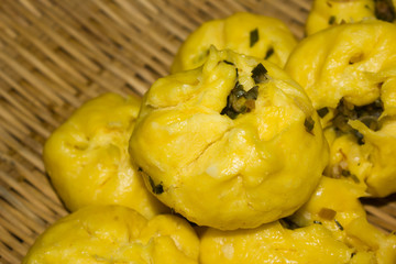 This is a photo of some yellow stuffed bun, was taken in SiChuan, China.