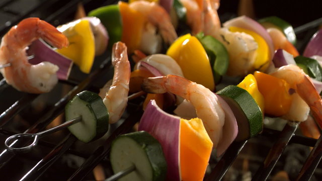 Shrimp and vegetable skewers on barbecue grill