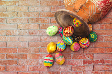 Set of colorful easter egg with clay jar on brown brick wall
