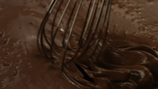 Mixing chocolate with a whisk