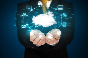 Businessman holding digital icons