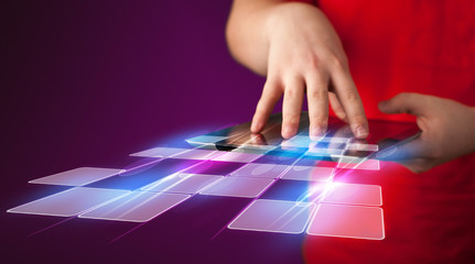 Naklejka premium Close up of hand holding tablet with cyber application